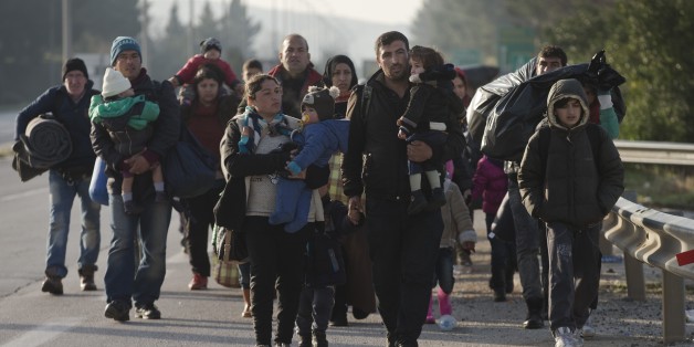 Refugees and migrants make their way to reach the borderline to Macedonia, near the northern Greek village of Idomeni, on Tuesday, Feb. 23, 2016. Police have removed hundreds of migrants from a camp during an operation at Greece's border with Macedonia following a protest that halted freight rail services to other Balkan countries. Journalists were not allowed to approach the area. (AP Photo/Petros Giannakouris)