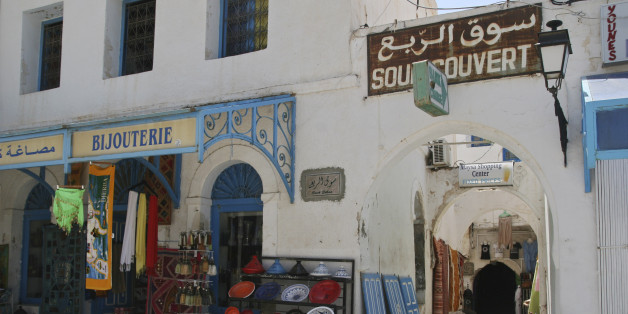 In this photo taken Sunday, July 9, 2011 an empty market is seen in the town of Houmet Souq on the island of Djerba, Tunisia. The whitewashed buildings in the central square of the small town gleam brightly in the blinding sun under the piercing blue of a July sky on the picturesque Tunisian island of Djerba. But the cafes in the sunplashed plazas and shaded archways of the market which would normally be bustling at this time of year are deserted as the local economy suffers from the disappearan