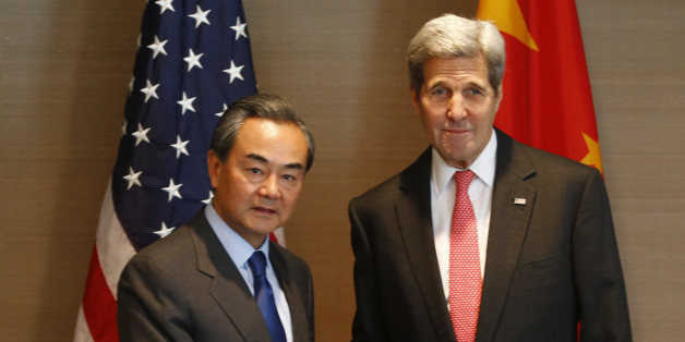 US Secretary of State John Kerry, right, shakes hands with China's Froreign, Minister Wang Yi, during a meeting in Munich, Germany prior to the start of the Munich Security Conference, Friday Feb. 12, 2016. (AP Photo/Matthias Schrader)