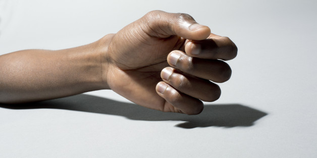 Black man's hand on grey