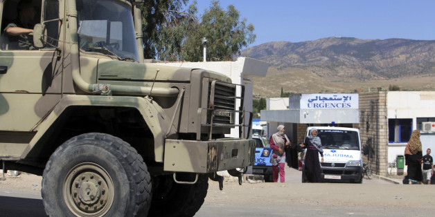 A military truck parks outside the hospital of Kasserine, near the Algerian border, Thursday, July 17, 2014. Militants in western Tunisia staged two simultaneous attacks on army posts while soldiers held a Ramadan feast, killing at least 14 soldiers, authorities said Thursday. (AP Photo/ Mouldi Kraeim)