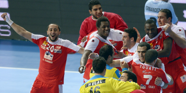 Tunisia's players celebrate their victory over Argentina during a preliminary round Group A Men's World Handball championship match in Barcelona, Spain, Friday, Jan. 18, 2013. (AP Photo/Manu Fernandez)