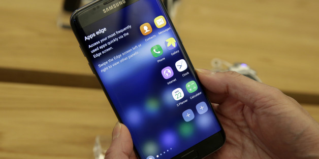 A Samsung Galaxy S7 Edge mobile phone is displayed during a preview of Samsung's flagship store, Samsung 837, in New York's Meatpacking District, Monday, Feb 22, 2016. Samsung is opening what it calls a "technology playground" in New York for customers to check out its latest gadgets. The center opens Tuesday, the day Samsung starts taking orders for its upcoming Galaxy S7 and S7 Edge phones. (AP Photo/Richard Drew)