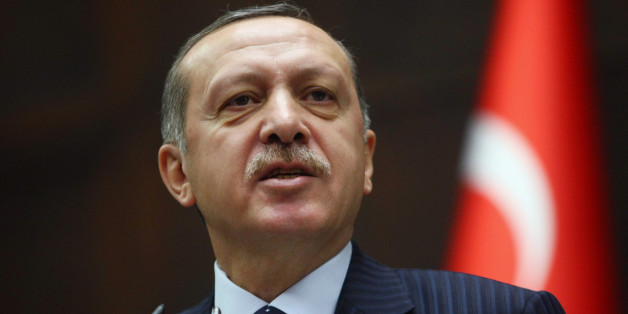 Turkey's Prime Minister Recep Tayyip Erdogan addresses his party members at the parliament in Ankara, Turkey, Tuesday, Nov. 22, 2011. Erdogan said for the first time that Syria's president must step down over the country's brutal crackdown on dissent, ratcheting up the pressure on the increasingly isolated Bashar Assad. In his harshest words yet, Ergodan reminded Assad of the bloody end of the Libyan leader Moammar Gadhafi, as well as past dictators, including Adolf Hitler.(AP Photo)