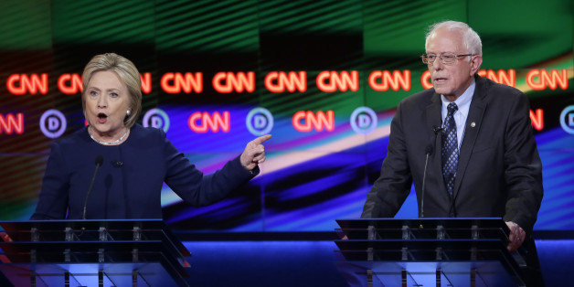 Democratic presidential candidate, Hillary Clinton argues a point as Sen. Bernie Sanders, I-Vt., right, listens during a Democratic presidential primary debate at the University of Michigan-Flint, Sunday, March 6, 2016, in Flint, Mich. (AP Photo/Carlos Osorio)