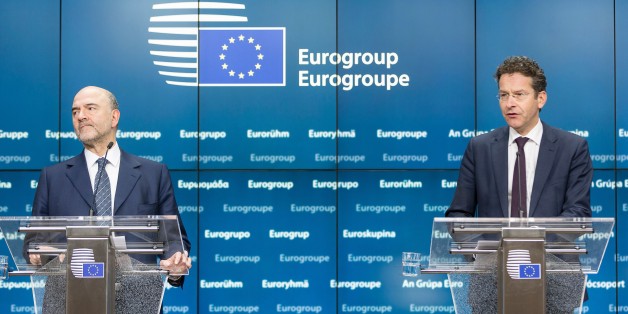 EU Economic and Financial Affairs, Taxation and Customs Commissioner Pierre Moscovici (L) and Eurogroup President and Dutch Finance Minister Jeroen Dijsselbloem address a press conference following a meeting of Eurogroup ministers at the European Council headquarters in Brussels on February 11, 2016. / AFP / THIERRY MONASSE (Photo credit should read THIERRY MONASSE/AFP/Getty Images)