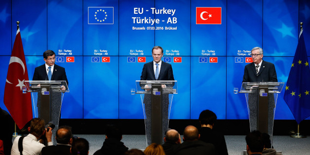 BRUSSELS, BELGIUM - MARCH 07: European council president, Donald Tusk (C) and Turkish Prime Minister Ahmet Davutoglu (L) and President of the European Commission, Jean-Claude Juncker (R) speak at the press conference after The European Council Meeting In Brussels held at the Justus Lipsius Building on March 7, 2016 in Brussels, Belgium. EU leaders are meeting with Turkish Prime Minister Ahmet Davutoglu in Brussels, to discuss the worst refugee crisis since the Second World War, as thousands of migrants remain stranded in Greece after borders along the Balkan route to Germany are closed. (Photo by Dean Mouhtaropoulos/Getty Images)