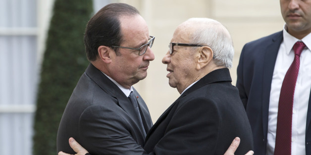 French President Francois Hollande, left, welcomes Tunisia's President Beji Caid Essebsi at the Elysee Palace in Paris, France, Saturday Nov. 14 , 2015. (AP Photo/Jacques Brinon)