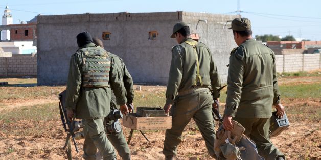 Tunisian special forces carry boxes of ammunition left behind by jihadists in the southern town of Ben Guerdane, near the Libyan border, during clashes with jihadists on March 8, 2016 a day after the attack on the border town.
Tunisian Prime Minister Habib Essid said around 50 extremists were believed to have taken part in Monday's coordinated attack on an army barracks and police and National Guard posts in the border town of Ben Guerdane.
/ AFP / FATHI NASRI (Photo credit should read FATHI NASRI/AFP/Getty Images)