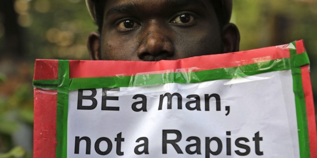 A man holds a placard as Indian Christians and others condemn the gang rape of a nun at a Christian missionary school in eastern India in Kolkata, India, Monday, March 16, 2015. According to police a nun in her 70s was gang-raped by a group of bandits when she tried to prevent them from committing a robbery in the Convent of Jesus and Mary School in West Bengal state's Nadia district. The attack early Saturday is the latest crime to focus attention on the scourge of sexual violence in India. (AP