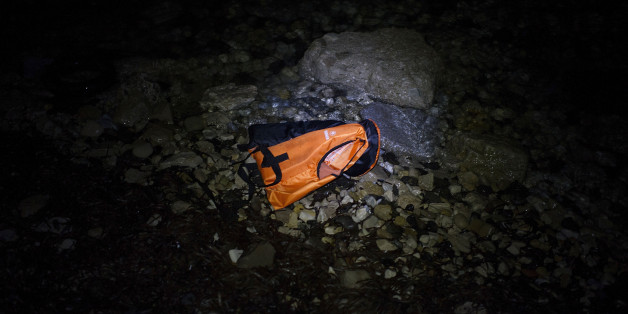 MYTELENE, GREECE - MARCH 09: A life vests floats in the water after an inflatable boat with refugees arrived, crossing the sea from Turkey to Lesbos, some 5 kilometres south of the capital of the Island, Mytelene on March 9, 2016 in Mytelene, Greece. During the night six inflatable baots reached the beaches of Lesbos. Joined Forces of the Standing NATO (North Atlantic Treaty Organisation) Maritime Group 2, including German Navy supply vessel 'Bonn' have arrived at the coast of the greek Island of Lesbos today in order to patrol between the coast of Turkey and Greece. Turkey has announced today to take back illegal migrants from Syria and to exchange those with legal migrants. (Photo by Alexander Koerner/Getty Images)