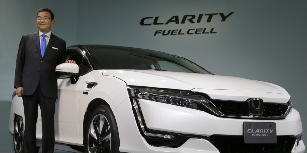 Honda Motor Co. President and Chief Executive Takahiro Hachigo poses for photographers during a press conference in the media preview of the Clarity Fuel Cell at the automaker's headquarters in Tokyo, Thursday, March 10, 2016. Honda has rolled out a new fuel cell vehicle, the first of its kind to be a five-seater. The zero-emissions Clarity may not sell in big numbers, however, given its price tag of 7.66 million yen ($67,000). (AP Photo/Shizuo Kambayashi)
