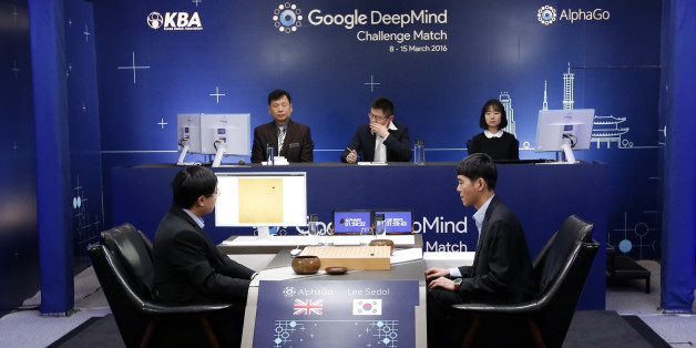 South Korean professional Go player Lee Sedol, right, prepares for his second stone against Google's artificial intelligence program, AlphaGo, as Google DeepMind's lead programmer Aja Huang, left, sits during the second match of the Google DeepMind Challenge Match in Seoul, South Korea, Thursday, March 10, 2016. Google's computer program AlphaGo defeated its human opponent, South Korean Go champion Lee Sedol, on Wednesday in the first face-off of a historic five-game match. (AP Photo/Lee Jin-man