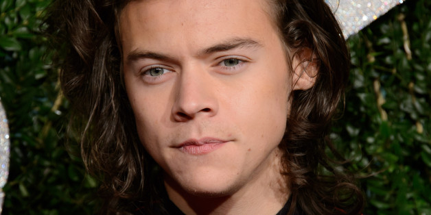 Harry Styles poses for photographers upon arrival at The British Fashion Awards 2014, in London, Monday, Dec. 1, 2014. (Photo by Jonathan Short/Invision/AP)