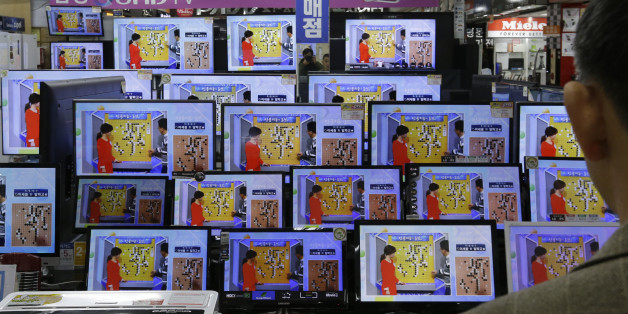 TV screens show the Google DeepMind Challenge Match at the Yongsan Electronic store in Seoul, South Korea, Wednesday, March 9, 2016. Googleâs computer program AlphaGo defeated its human opponent, Lee Sedol, in the first game of their highly anticipated five-game match.(AP Photo/Ahn Young-joon)