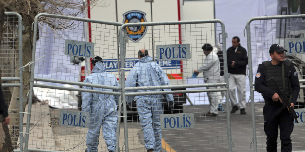 Security and forensic officials work at the site of Sunday's explosion in the busy center of Turkish capital, Ankara Monday, March 14, 2016. The explosion is believed to have been caused by a car bomb that went off close to bus stops. (AP Photo/Burhan Ozbilici)