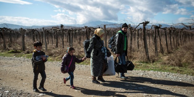 A migrant family crosses the Greek-Macedonian border near the town of Gevgelija, on February 14, 2016.
Dutch Foreign minister Bert Koenders on February 14, 2016 spent an hour in a Vinojug recipient center near Gevgelija talking with migrants, children, UNICEF and Red Cross representatives, police and others members who are taking care of migrants heading to the EU from devastated homes in Syria, Afghanistan and Iraq. / AFP / Robert ATANASOVSKI (Photo credit should read ROBERT ATANASOVSKI/AFP/Getty Images)