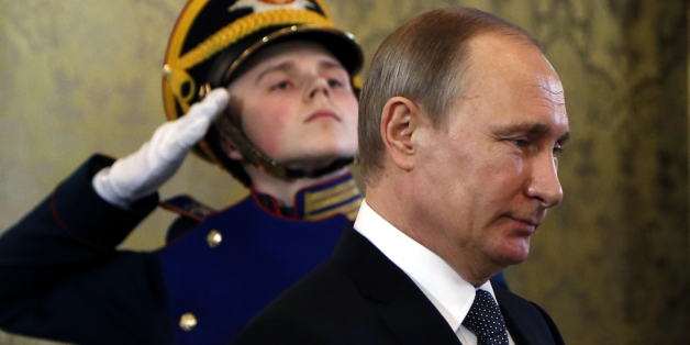 Russian President Vladimir Putin, foreground, walks to meet with Morocco's King Mohammed VI in the Kremlin in Moscow, Russia, Tuesday, March 15, 2016. Moroccan King Mohammed VI is on an official visit in Russia. (Maxim Shipenkov/Pool photo via AP)