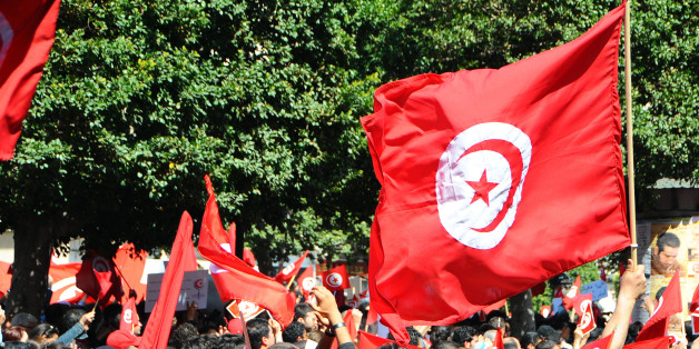 A crowd invades the streets during a demonstration to celebrate Tunisia's independence, Tuesday, March, 20, 2012 in Tunis. On March 20, 1956, Tunisia achieved independence from France led by Habib Bourguiba, who became the first President of the Republic of Tunisia. (AP Photo/Hassene Dridi)