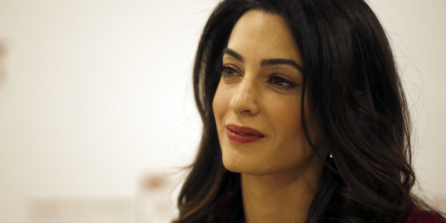 British lawyer Amal Clooney attends a press conference with former Maldives president Mohamed Nasheed in London, Monday, Jan. 25, 2016. President Nasheed is the first democratically-elected leader of his country and a renowned champion for human rights and climate justice. In March 2015, he was sentenced to 13 years' imprisonment in the Maldives by the authoritarian regime of Abdulla Yameen, the half-brother of a former dictator. (AP Photo/Alastair Grant)