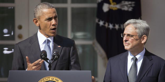 Federal appeals court judge Merrick Garland, right, stands with President Barack Obama as he is introduced as Obama's nominee for the Supreme Court during an announcement in the Rose Garden of the White House, in Washington, Wednesday, March 16, 2016. (AP Photo/Pablo Martinez Monsivais)