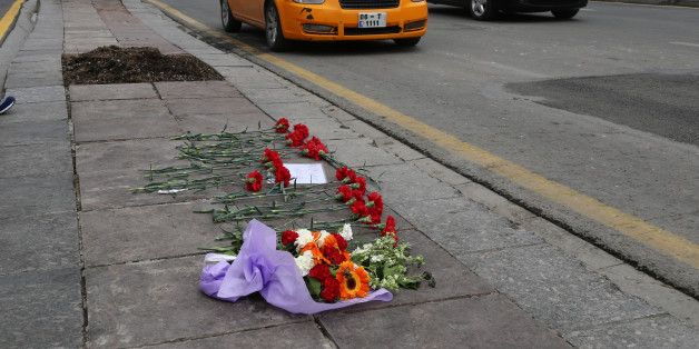 Flowers left by local people at Sunday's explosion site in Ankara, Turkey, Tuesday, March 15, 2016. Turkey on Tuesday identified the attacker who carried out a deadly suicide bombing in Ankara as a 24-year-old woman who allegedly joined the Kurdish rebel group in 2013 and trained in Syria. An Interior Ministry statement identified the suicide car bomber blamed for killing 37 people, including herself, on Sunday as Seher Cagla Demir. A possible male accomplice, who was also killed, has not yet be