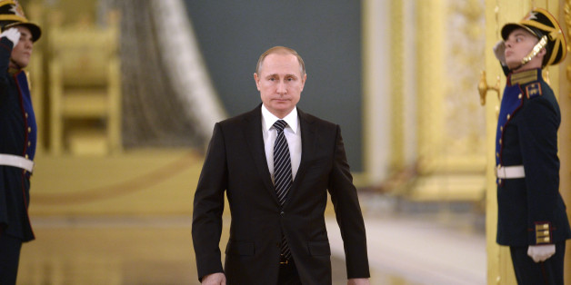 Russian President Vladimir Putin walks in Moscow's Kremlin, Russia on Thursday, March 17, 2016. President Vladimir Putin says Russia can again build up its forces in Syria âin a few hoursâ if necessary, and will continue striking extremist groups. Putin made the statement in the Kremlin Thursday while honoring Russian military officers who have taken part in the Syrian campaign. (Alexei Nikolsky/Sputnik, Kremlin Pool Photo via AP)