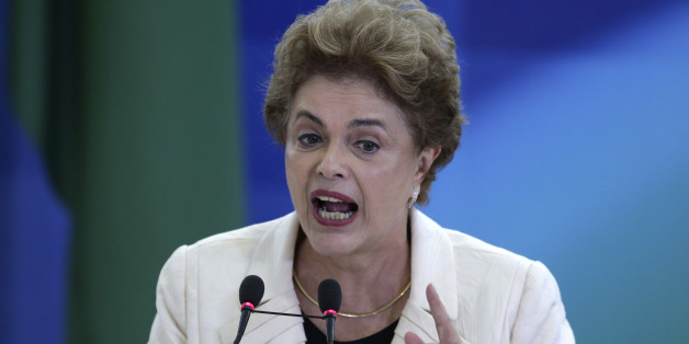 Brazil's President Dilma Rousseff speaks during a ceremony in which her predecessor, Luiz Inacio Lula da Silva, was sworn in as chief of staff, at the Planalto presidential palace, in Brasilia, Brazil, Thursday, March 17, 2016. Rousseff insisted Silva would help put the troubled country back on track and denounced attempts to oust her. (AP Photo/Eraldo Peres)