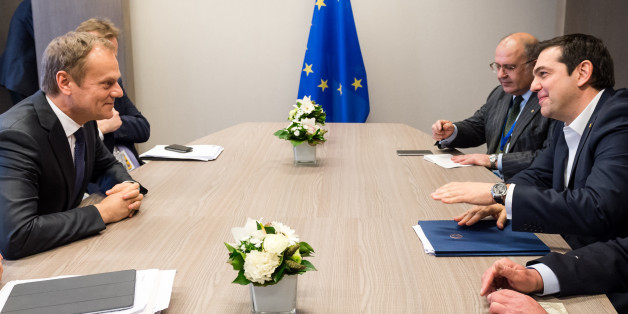 European Council President Donald Tusk, left, speaks with Greek Prime Minister Alexis Tsipras, right, during a meeting on the sidelines of an EU summit at the EU Council building in Brussels on Thursday, March 17, 2016. In the first day of a two-day summit, European Union leaders hope to seal a deal with Turkey to send back tens of thousands of migrants amid deep divisions over how to manage Europe's biggest refugee emergency in decades. (AP Photo/Geert Vanden Wijngaert, Pool)