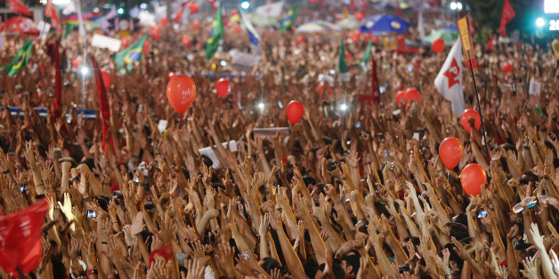 Demonstrators attend a rally in support of Brazil's President Dilma Rousseff and former President Luiz Inacio Lula da Silva, in Sao Paulo, Brazil, Friday, March 18, 2016. Supporters of Silva gathered for rallies in a handful of cities across Brazil, particularly in the industrial south, where the former factory worker has his base. Silva has been tied to a sprawling corruption investigation involving the Brazil oil giant Petrobras. (AP Photo/Andre Penner)