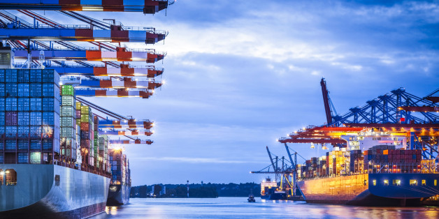 Container terminal with huge container cargo ship ready for unloading