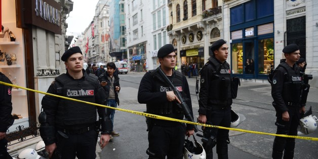 ISTANBUL, TURKEY - MARCH 19: Turkish Police officers block the Istiklal street as they take security measures after an explosion at Istiklal street in Istanbul, Turkey on March 19, 2016. (Photo by Mohammed Elshamy/Anadolu Agency/Getty Images)