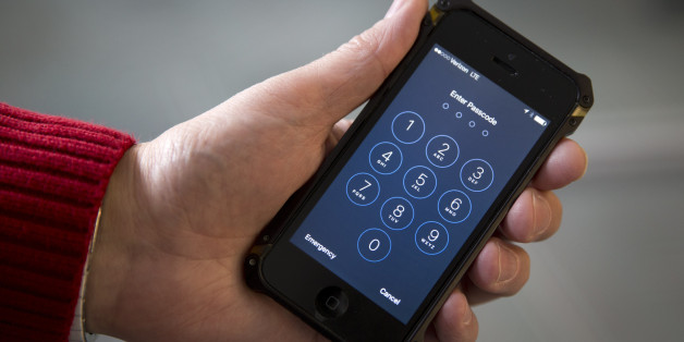 FILE - This Feb. 17, 2016 file photos an iPhone is seen in Washington. The dispute over whether Apple must help the FBI hack into a terror suspect's iPhone is about to play out in a Southern California courtroom. The hearing Tuesday, March 22, in U.S. District Court in Riverside is the first in the battle that has seen Cook and FBI Director James Comey spar over issues of privacy and national security. (AP Photo/Carolyn Kaster,File)