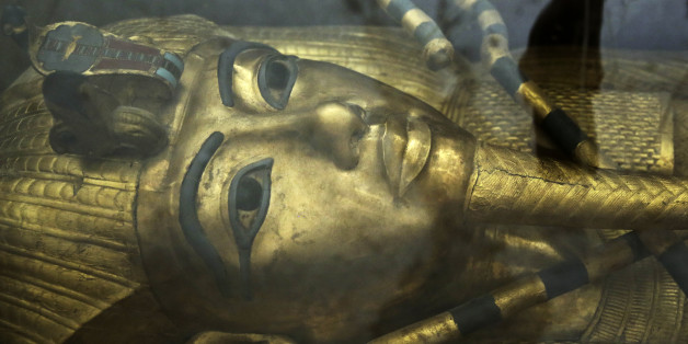 The tomb of King Tut is displayed in a glass case at the Valley of the Kings in Luxor, Egypt, Tuesday, Sept. 29, 2015. Egypt's antiquities minister said King Tut's tomb may contain hidden chambers, lending support to a British Egyptologist's theory that a queen may be buried in the walls of the 3,300 year-old pharaonic mausoleum. (AP Photo/Nariman El-Mofty)