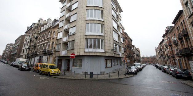 The apartment complex which was raided by police on Tuesday night after twin bomb attacks, center, is seen in Brussels, Belgium, Wednesday, March 23, 2016. Belgian state media reports that the police confirmed that two brothers Khalid en Ibrahim El Bakraoui were involved in the deadly suicide attacks on the Brussels airport and its subway system. (AP Photo/Peter Dejong)