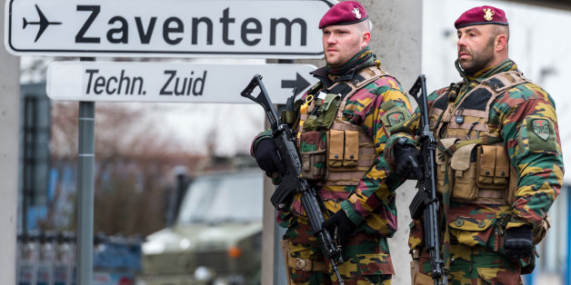 Belgian Army soldiers patrol at Zaventem Airport in Brussels on Wednesday, March 23, 2016. Belgian authorities were searching Wednesday for a top suspect in the country's deadliest attacks in decades, as the European Union's capital awoke under guard and with limited public transport after 34 were killed in bombings on the Brussels airport and a subway station. (AP Photo/Geert Vanden Wijngaert)