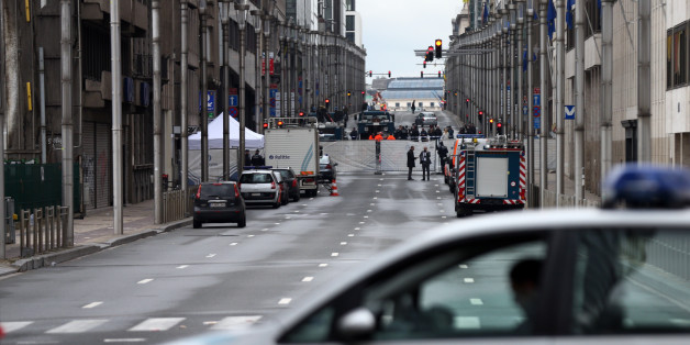 BRUSSELS, BELGIUM - MARCH 23: A police car blocks a road near Maelbeek metro station following yesterday's attack, on March 23, 2016 in Brussels, Belgium. Belgium is observing three days of national mourning after 34 people were killed in a twin suicide blast at Zaventem Airport and a further bomb attack at Maelbeek Metro Station. Two brothers are thought to have carried out the airport attack and an international manhunt is underway for a third suspect. The attacks come just days after a key suspect in the Paris attacks, Salah Abdeslam, was captured in Brussels. (Photo by Carl Court/Getty Images)