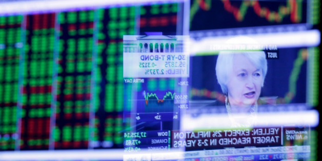 The Washington news conference of Federal Reserve Chair Janet Yellen is reflected in a specialist's screen on the floor of the New York Stock Exchange, Wednesday, March 16, 2016. The Fed is keeping short-term interest rates unchanged at a range between 0.25 percent and 0.5 percent, citing the risks posed by global economic and financial turmoil. (AP Photo/Richard Drew)