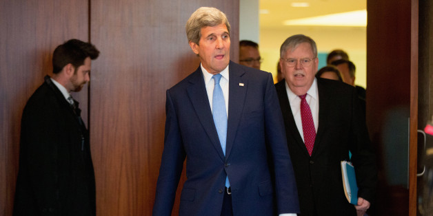 Secretary of State John Kerry, accompanied by US Ambassador to Russia John Tefft, right, arrives to meets with members of the young civil society at the U.S. Embassy in Moscow, Russia, Wednesday, March 23, 2016. Kerry is in Russia for talks on Ukraine and Syria as the terrorist attacks in Brussels underscored the urgency of fighting the Islamic State group. (AP Photo/Andrew Harnik, Pool)