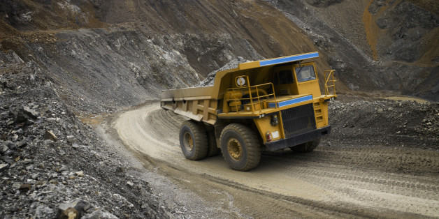 Dump truck driving from bottom of quarry.