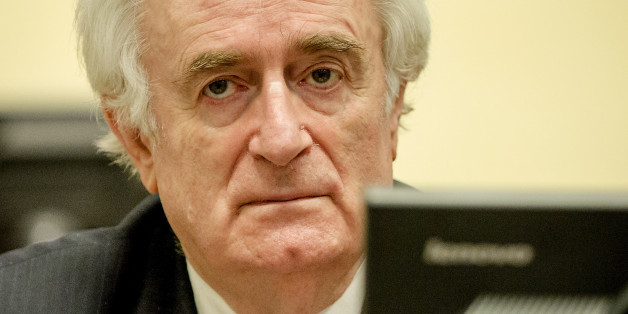 Bosnian Serb wartime leader Radovan Karadzic in the courtroom for the reading of his verdict at the International Criminal Tribunal for Former Yugoslavia (ICTY) in The Hague, The Netherlands Thursday March 24, 2016. The former Bosnian-Serbs leader is indicted for genocide, crimes against humanity, and war crimes. (Robin van Lonkhuijsen, Pool via AP)