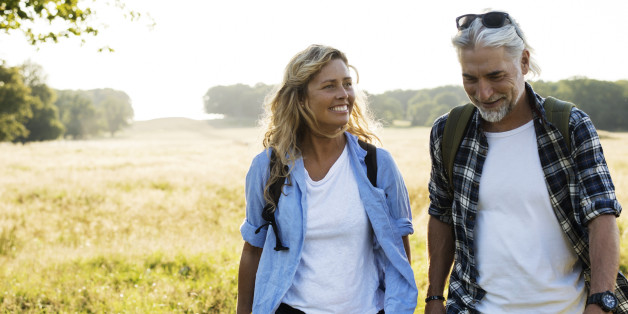 Smiling Mature Man and Woman hiking