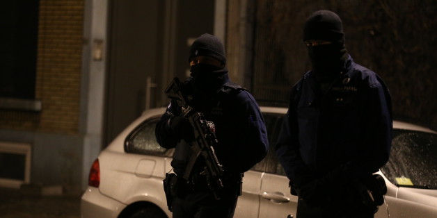 Police officers take part in an operation in Schaerbeek - Schaarbeek, Brussels, late on March 24, 2016.
Six people were arrested on March 24, 2016 in a series of police operations in the Belgian capital, the federal prosecutor's office said, two days after jihadist attacks in Brussels left 31 dead. Raids have also taken place in the Brussels district of Schaerbeek where the three airport attackers left from on March 22 morning carrying three explosive-packed suitcases. There have been no arrests in the neighbourhood. / AFP / Belga / NICOLAS MAETERLINCK / Belgium OUT (Photo credit should read NICOLAS MAETERLINCK/AFP/Getty Images)