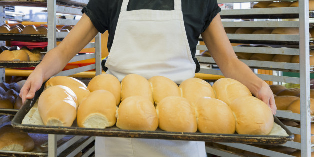 Hispanic baker working in commercial kitchen