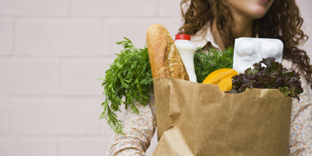 Woman carrying a bag of groceries