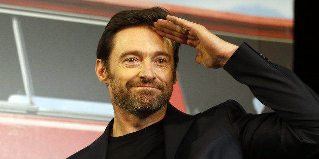 Actor Hugh Jackman greets to the media upon his arrival for a press conference for his new movie "Eddie The Eagle" in Seoul, South Korea, Monday, March 7, 2016. The movie is to be released in South Korea on April 7. (AP Photo/Lee Jin-man)