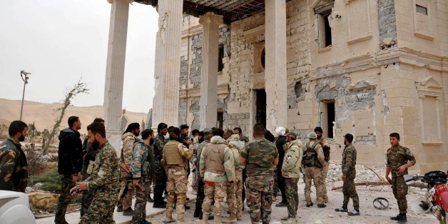 Forces loyal to Syria's President Bashar al-Assad gather at a palace complex on the western edge of Palmyra in this picture provided by SANA on March 24, 2016. REUTERS/SANA/Handout via Reuters ATTENTION EDITORS - THIS PICTURE WAS PROVIDED BY A THIRD PARTY. REUTERS IS UNABLE TO INDEPENDENTLY VERIFY THE AUTHENTICITY, CONTENT, LOCATION OR DATE OF THIS IMAGE. FOR EDITORIAL USE ONLY. NOT FOR SALE FOR MARKETING OR ADVERTISING CAMPAIGNS. THIS PICTURE IS DISTRIBUTED EXACTLY AS RECEIVED BY REUTERS, AS A