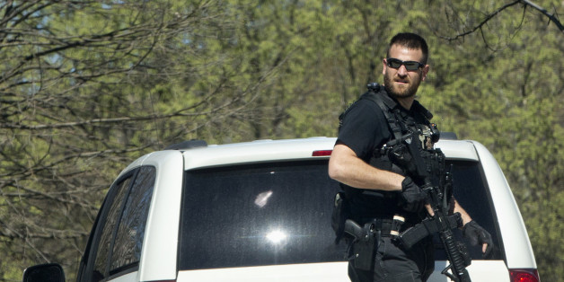 A Secret Service Police Officer patrols the North Lawn of the White House in Washington, Monday, March 28, 2016, after reports of an active shooter at the U.S. Capitol. A U.S. Capitol Police officer was shot and injured Monday, March 28, 2016, at the Capitol Complex. The officer was not seriously injured and the shooter was caught and is in custody, Capitol officials said. (AP Photo/Jacquelyn Martin)
