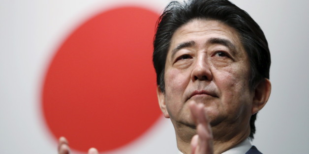 Japan's Prime Minister Shinzo Abe claps his hands during the ruling Liberal Democratic Party (LDP) annual convention in Tokyo, Japan, March 13, 2016. REUTERS/Yuya Shino