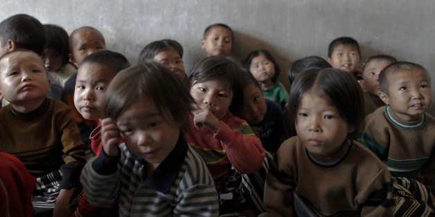EDITORS NOTE: PICTURES TAKEN ON A GOVERNMENT CONTROLLED TOUR FOR REUTERS ALERTNET North Korean orphans wait to be examined for possible signs of malnutrition in an area damaged by summer floods and typhoons in South Hwanghae province, September 29, 2011. Isolated North Korea has appealed for food aid following the disasters and years of mismanagement. In South Hwanghae province, which traditionally produces about a third of the country's total cereal supply, officials say a savage winter wiped o